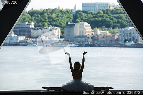 Image of Silhouette of graceful ballerina in white tutu