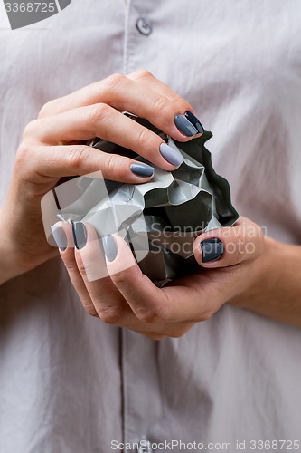 Image of Stylish manicure in shades of gray female elegant handles.