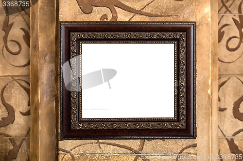 Image of Wooden old frame on the wall with empty content