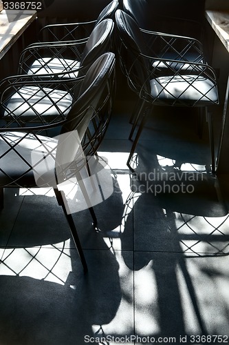 Image of Shadow of beautiful chairs on the floor