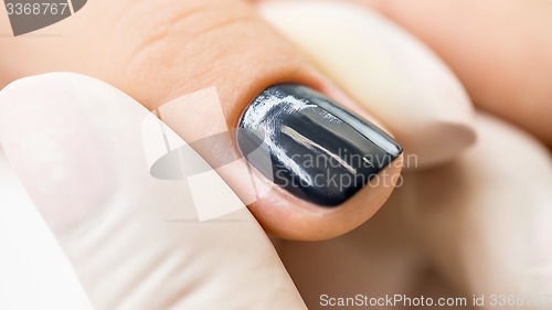 Image of Manicure process in a beauty salon.