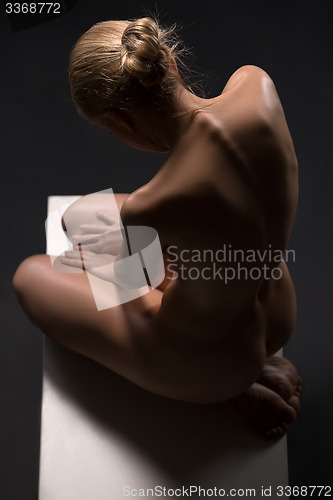 Image of Art nude picture of naked blonde in the studio