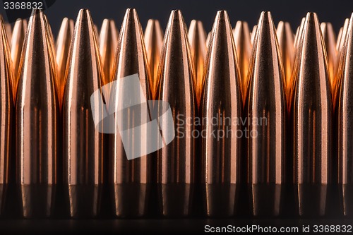 Image of Macro shot of copper bullets that are in many row