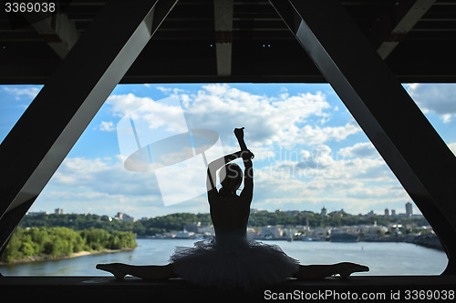 Image of Silhouette of graceful ballerina in white tutu