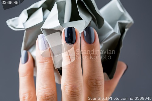 Image of Stylish manicure in shades of gray female elegant handles.