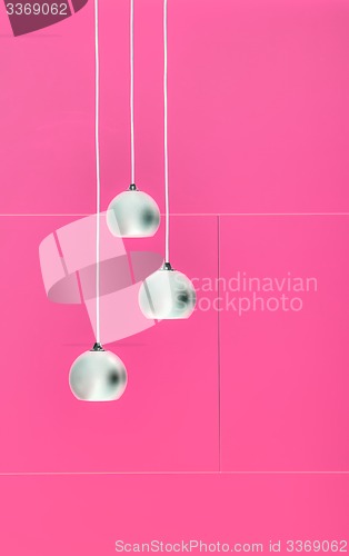 Image of Pimk negative collage of three ceiling lights