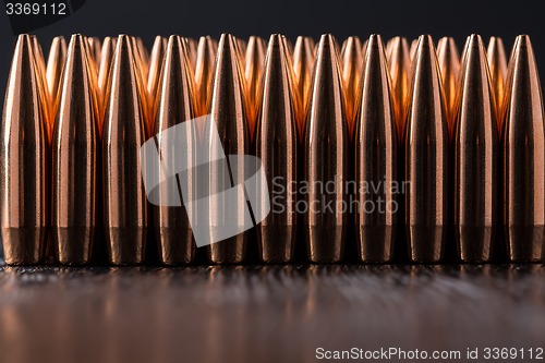 Image of Macro shot of copper bullets that are in many row