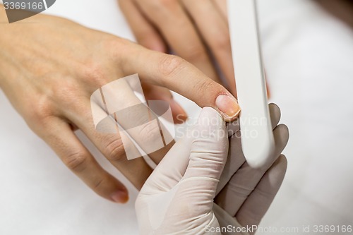 Image of Photograph potsesse manicure in a beauty salon.