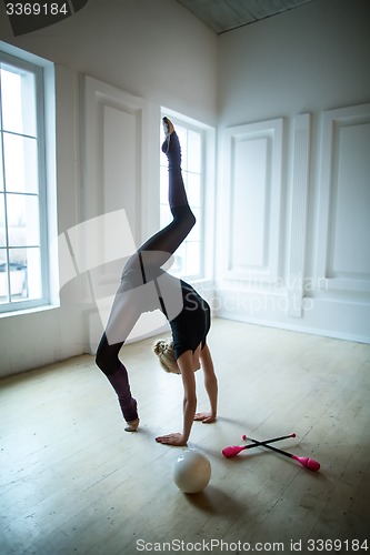 Image of Flexible gymnast doing exercise