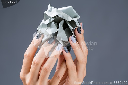 Image of Stylish manicure in shades of gray female elegant handles.