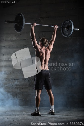 Image of Athlete with barbell.