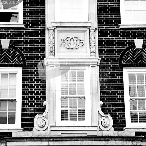 Image of old window in europe london  red brick wall and      historical 