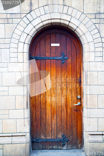 Image of wooden parliament in london old church door and marble antique  