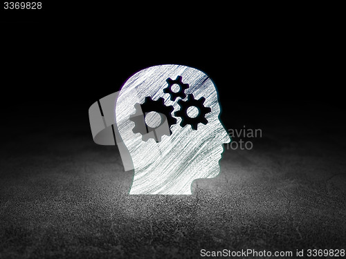 Image of Information concept: Head With Gears in grunge dark room