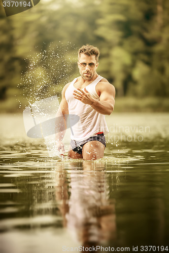 Image of muscular man lake