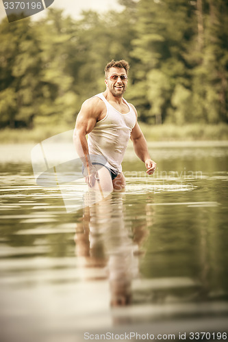 Image of muscular man lake