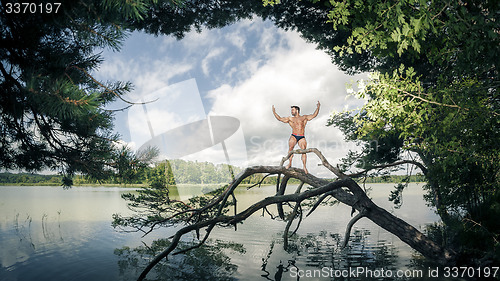 Image of muscular man lake