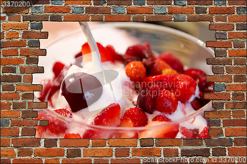 Image of brick wall and icecream with berries