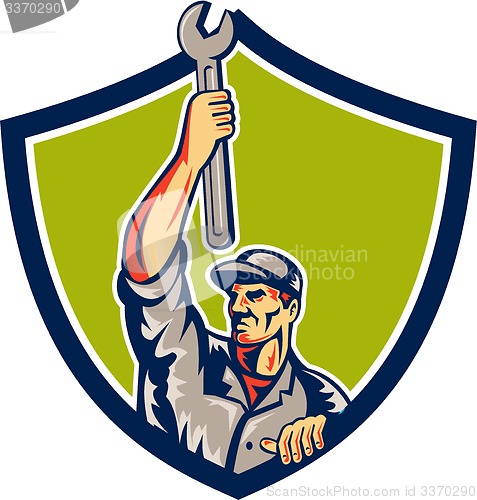 Image of Mechanic Raising Up Spanner Wrench Shield Retro