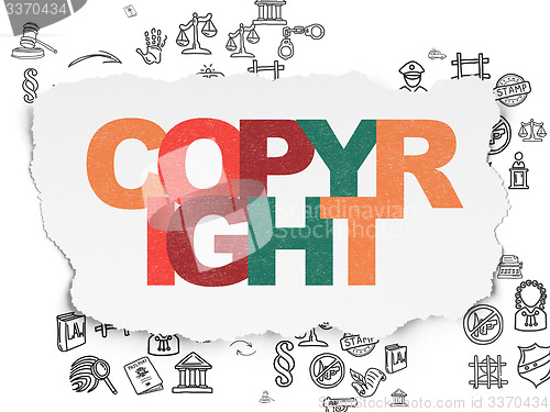 Image of Law concept: Copyright on Torn Paper background