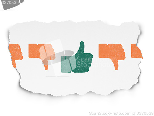 Image of Social network concept: thumb up icon on Torn Paper background