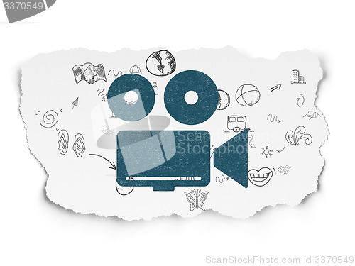 Image of Vacation concept: Camera on Torn Paper background