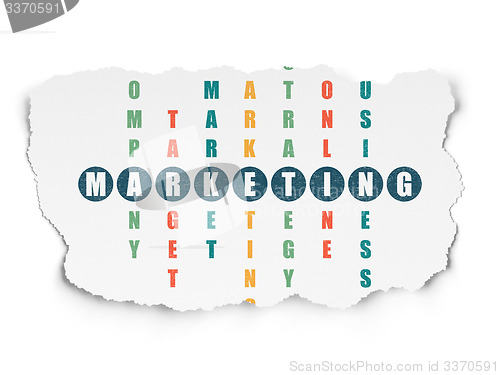 Image of Advertising concept: word Marketing in solving Crossword Puzzle