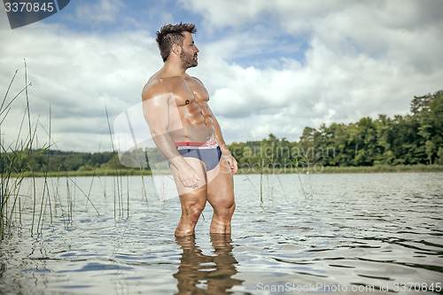 Image of muscular man lake