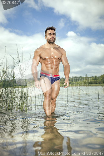 Image of muscular man lake