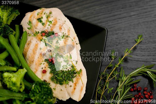 Image of Delicious portion of chicken breast with steamed vegetables