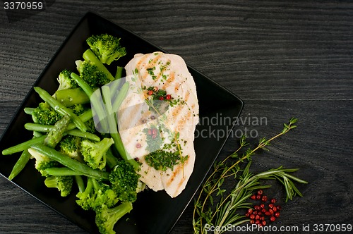 Image of Delicious portion of chicken breast with steamed vegetables
