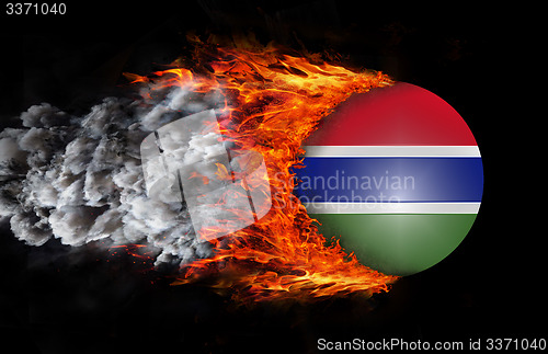 Image of Flag with a trail of fire and smoke - Gambia