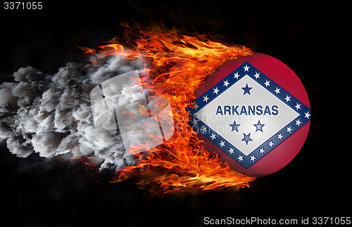 Image of Flag with a trail of fire and smoke - Arkansas