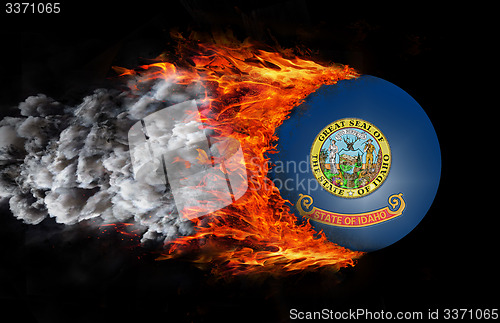 Image of Flag with a trail of fire and smoke - Idaho