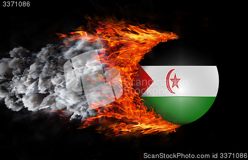 Image of Flag with a trail of fire and smoke - Western Sahara