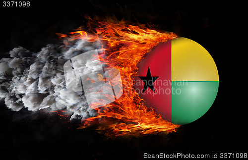 Image of Flag with a trail of fire and smoke - Guinea Bissau