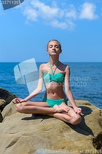 Image of The girl sunbathes