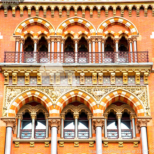 Image of old architecture in london england windows and brick exterior   