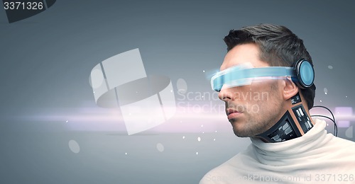 Image of man with futuristic glasses and sensors