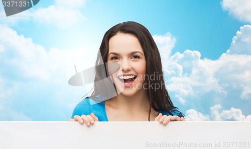 Image of smiling young girl with blank white board