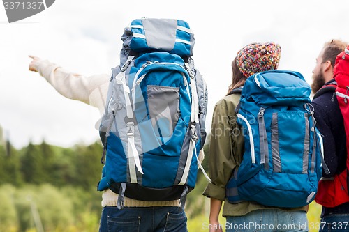 Image of group of friends with backpacks hiking