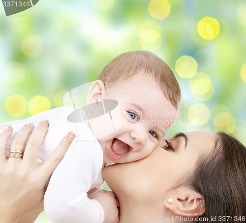 Image of happy mother with baby over green background