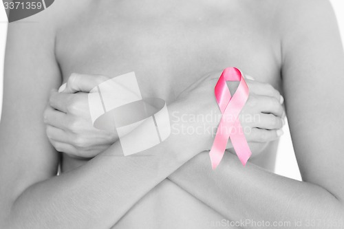 Image of naked woman with breast cancer awareness ribbon