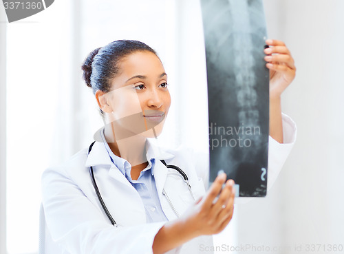 Image of african doctor looking at x-ray