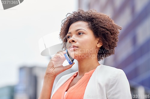 Image of african businesswoman calling on smartphone