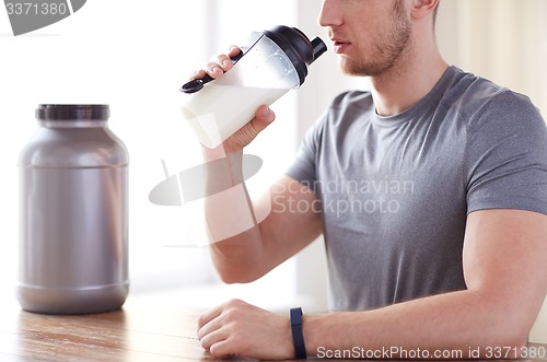 Image of close up of man drinking protein shake