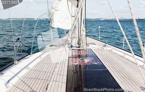 Image of close up of sailboat or sailing yacht deck and sea