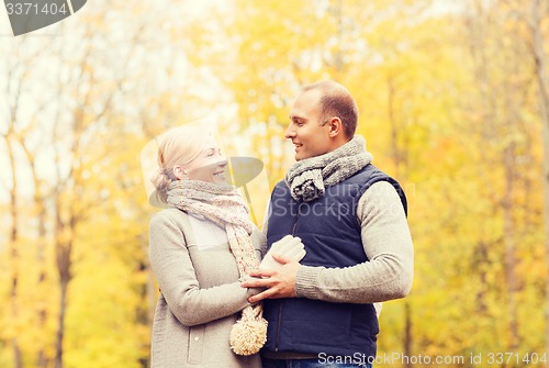 Image of smiling couple in autumn park