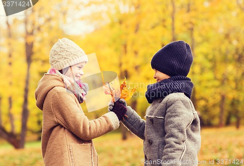 Image of smiling children in autumn park