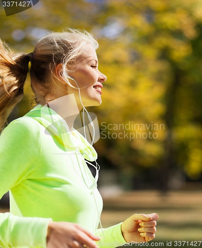 Image of woman doing running outdoors